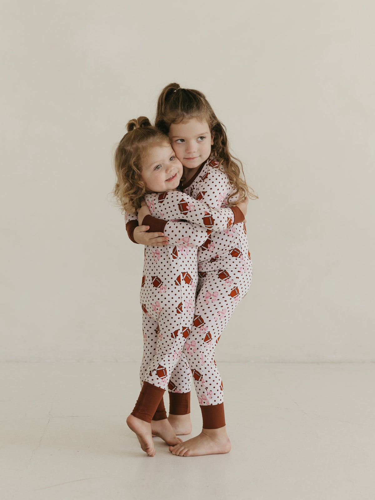 Footballs & Bows | Bamboo Zipper Pajamas