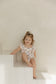 Classic Pooh | Bamboo Cross-Back Ruffle Romper